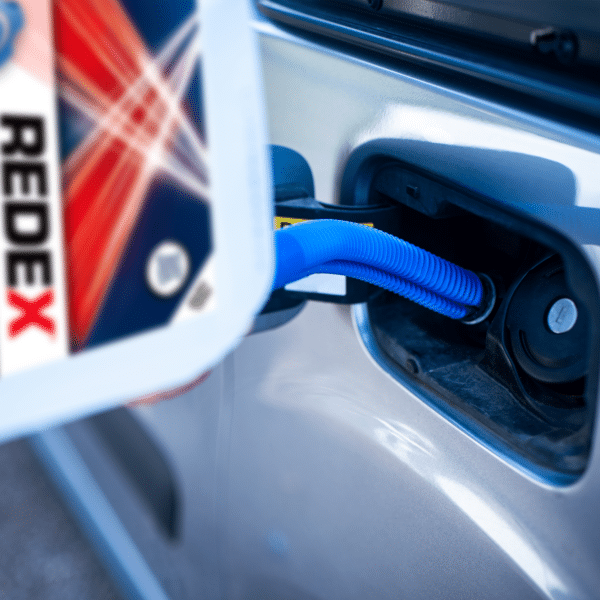Zoomed in image of Ad blue 10L being poured into car tank