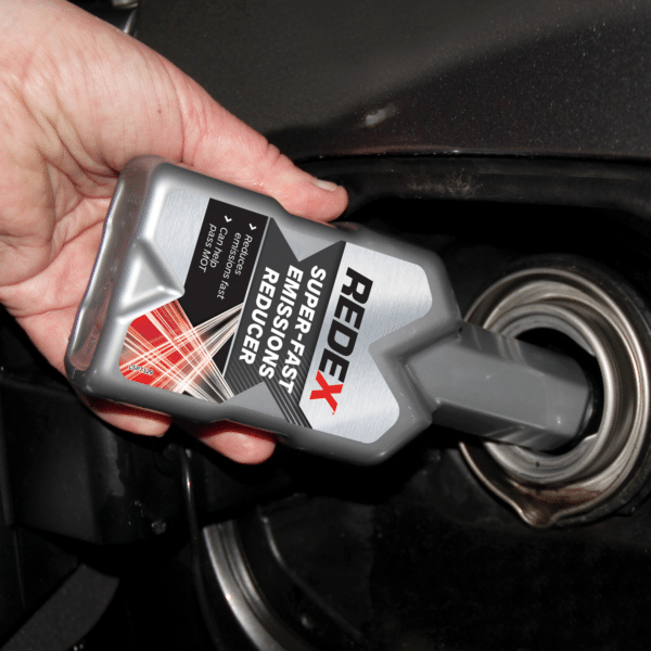 Redex Super Fast Emissions Reducer Diesel being poured into fuel tank