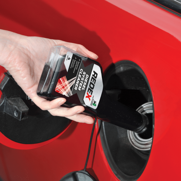 The Redex Diesel System Cleaner being poured into a car's engine