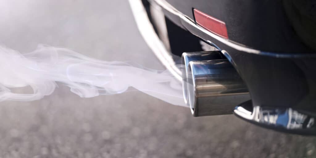 Image of a cars exhaust smoking out steam