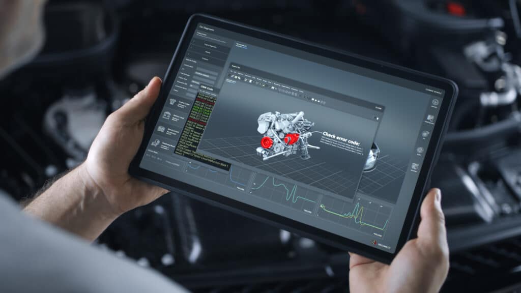 Male mechanic holding a tablet with a diagram of a car engine diognostic