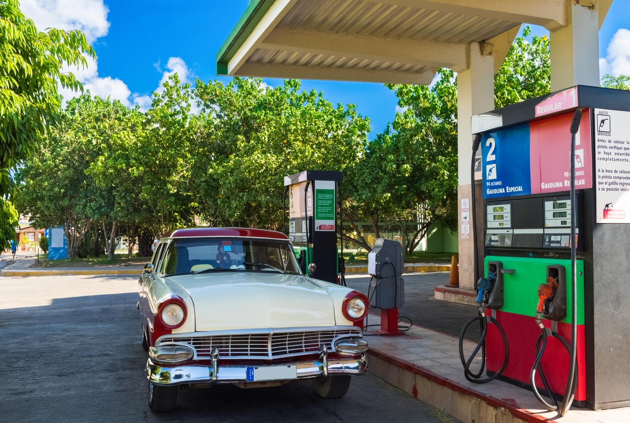 American white red vintage car on the gas station in Varadero Cuba - Serie Cuba Reportage